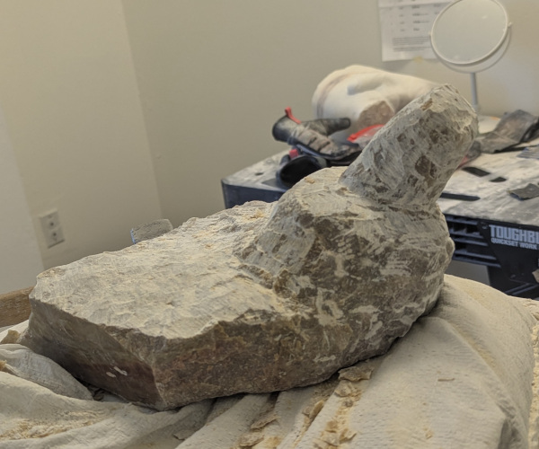 a sculpture made from alabaster featuring an erect penis