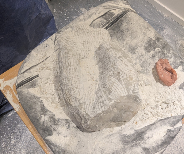 a sculpture depicting a hand