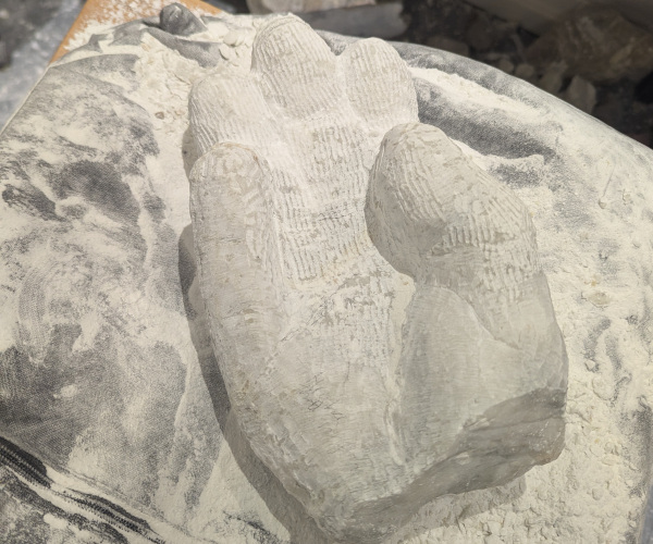 a sculpture depicting a hand